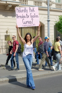 The Romanian social media personality known as Ioana cu pancarta walking along the pedestrianized Calea Victoriei in Bucharest
